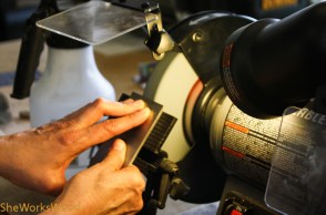 Grinder set at 25 degrees. I put light pressure on the blade with my right thumb and lightly press with the fingers on my left hand close to the edge.   I use my fingers to feel when the blade is getting too hot. 